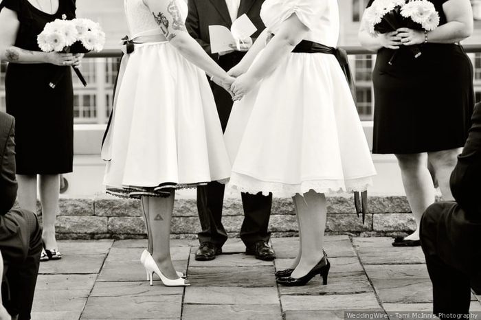 Who is holding the bouquet during the ceremony? 1