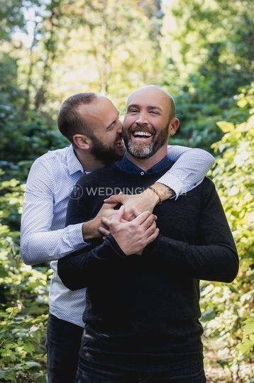 sweet same sex gay couple engagement hug