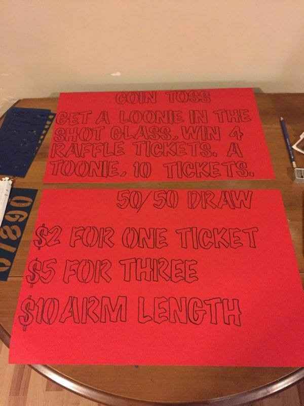 coin toss and 50/50 draw sign