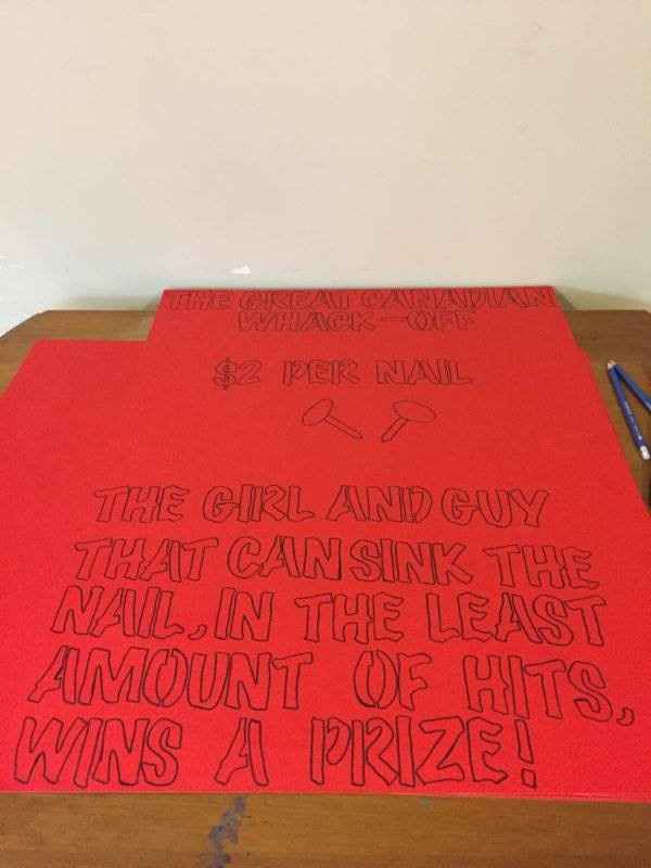 nail and hammer game sign