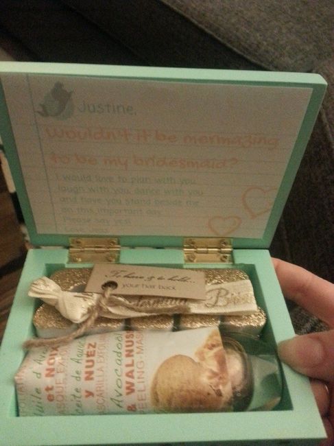 Inside of the box had a bridesmaid hair tie with "To have and to hold your hair back" tag, a face ma