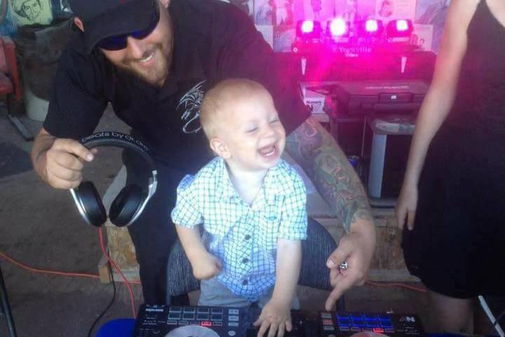 Little Man Spinning Some Tunes