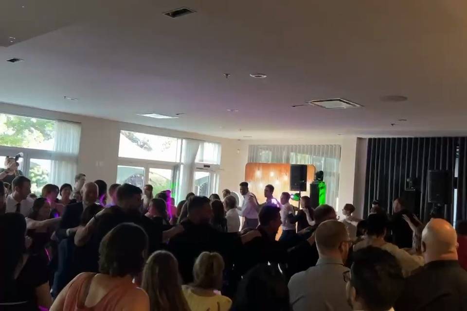 Wedding guests celebrating on the dance floor