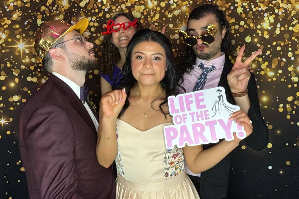 Newlyweds and friends at the photo booth