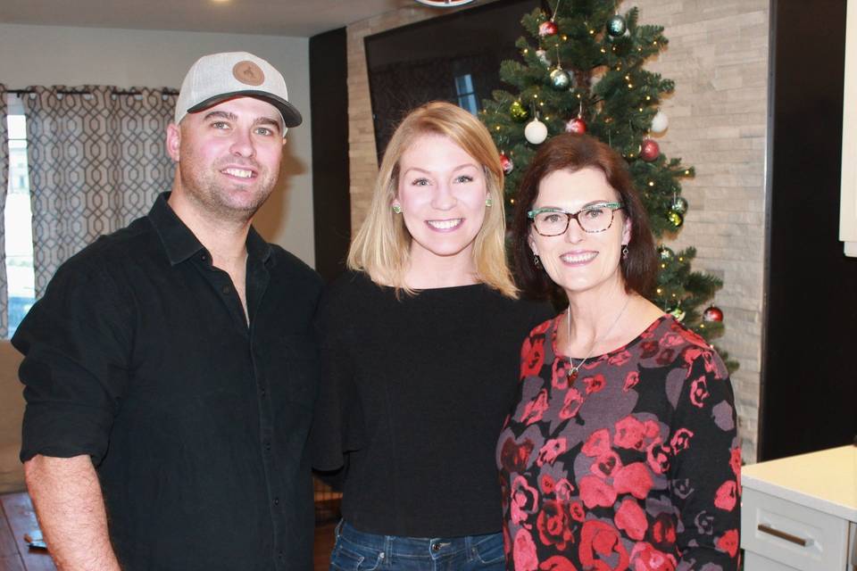 A happy couple with officiant