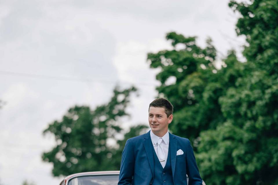 Groom with sports car
