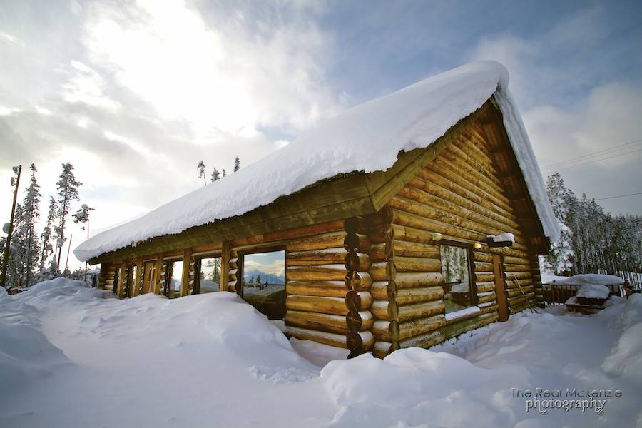 Log cabin in the snow