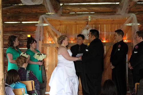 Indoor ceremony in barn.