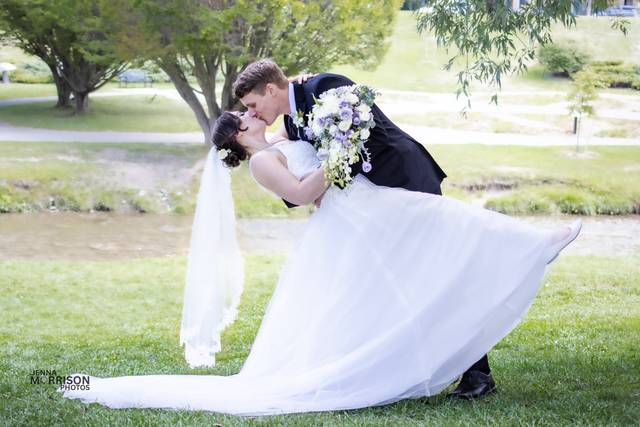 Groom dipping bride