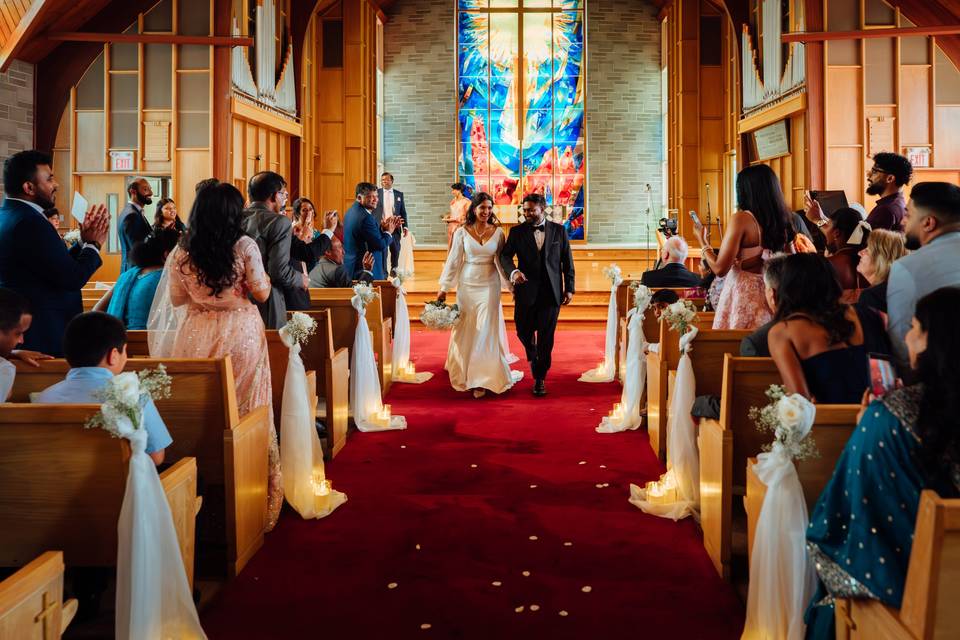 Couple walking down the aisle