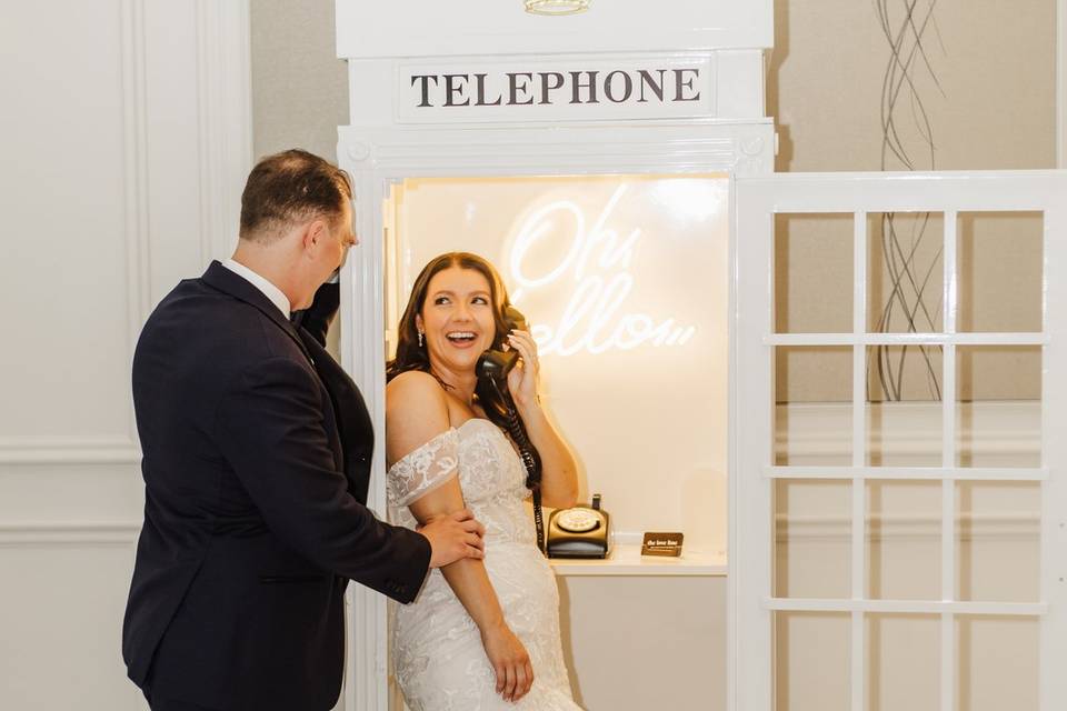 Bride and groom in phone booth