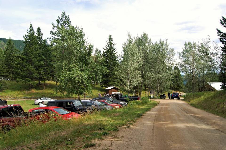 Parking to left, barn to right