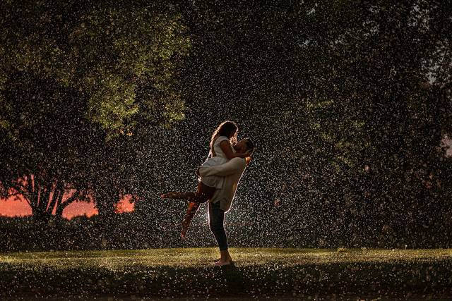 Engaged couple in the rain
