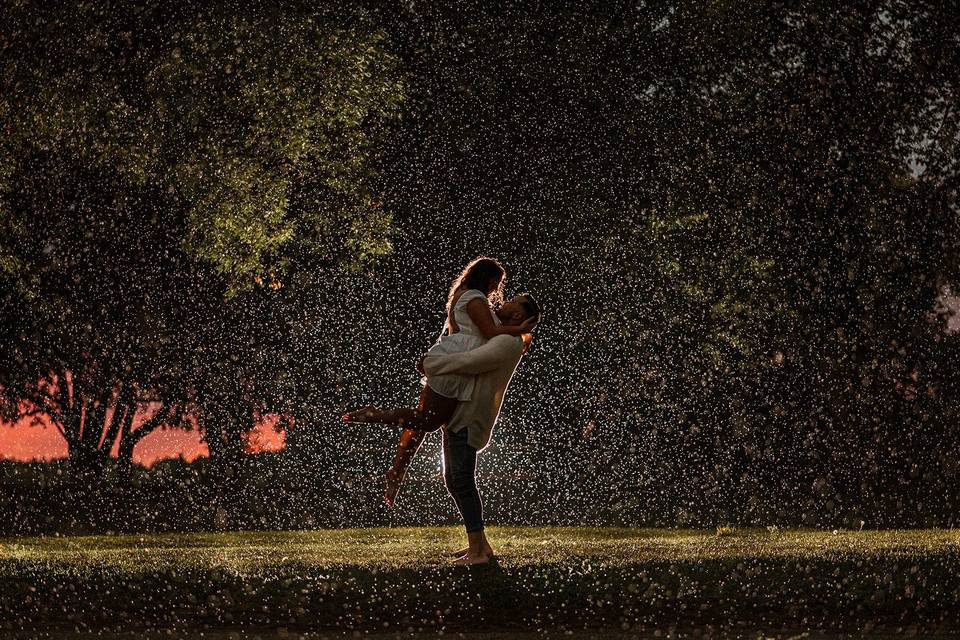 Engaged couple in the rain