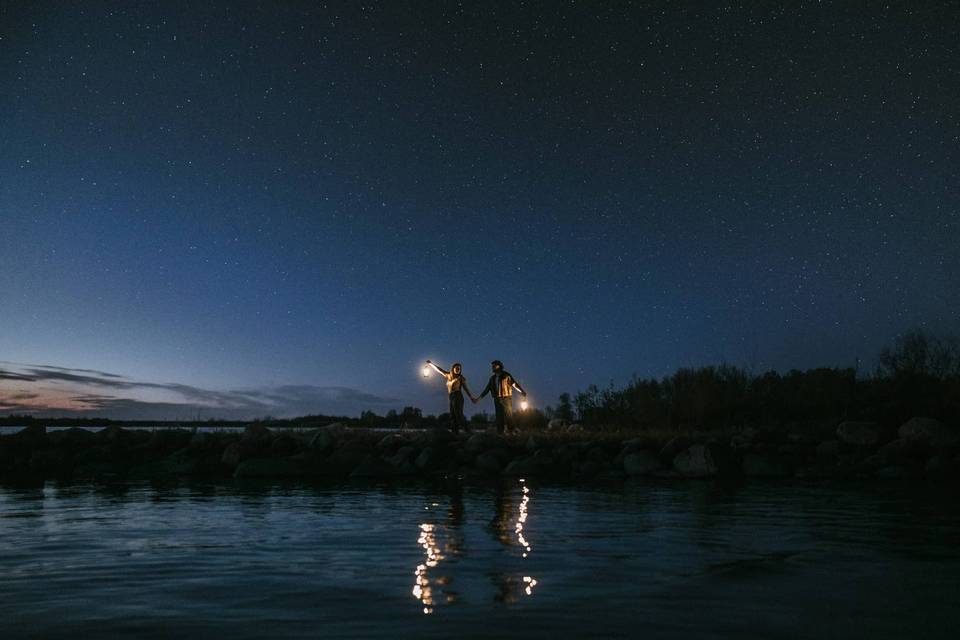 Engaged couple under the stars