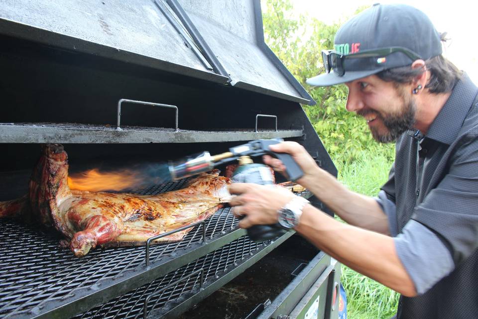 Whole lamb on charcoal BBQ