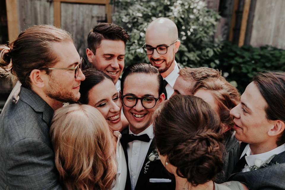 Bridal party group hug