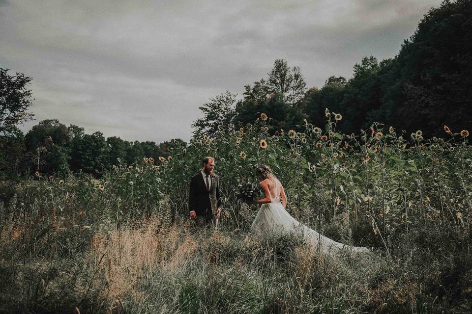 Bride & Groom in flower fiel