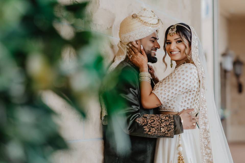 Holding each other and smiling to the camera