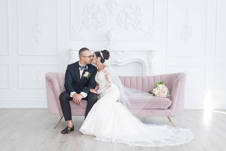 Seated on a lavender couch