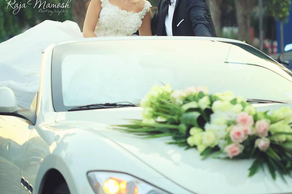 Newlyweds in convertible