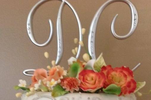 Silver coral monogram cake