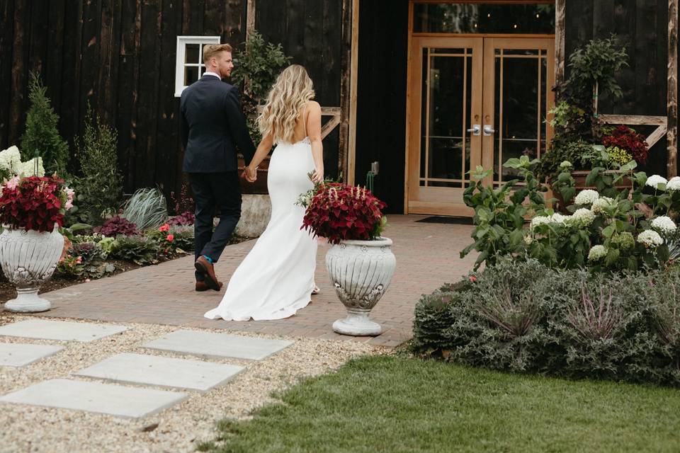 Couple walking into the barn