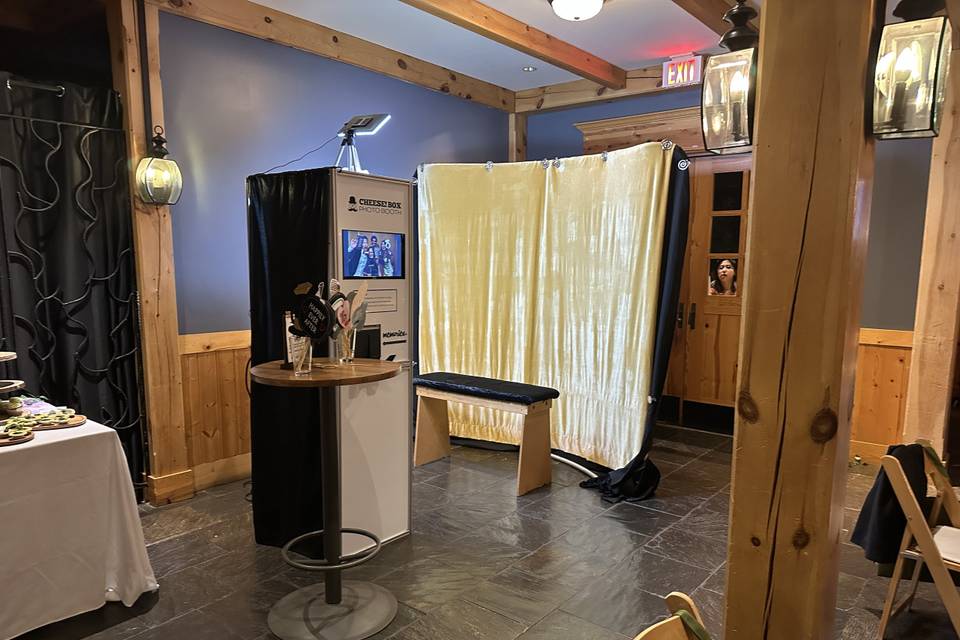 Open booth with gold curtain