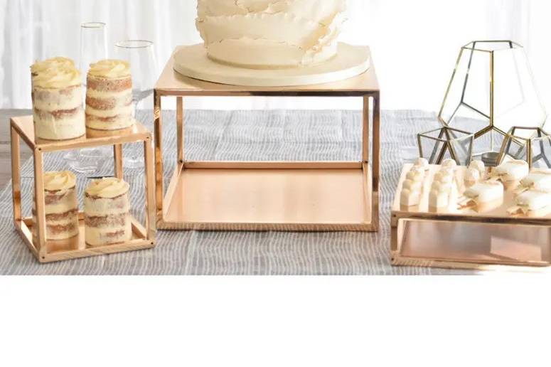 Large gold metal cake plinth