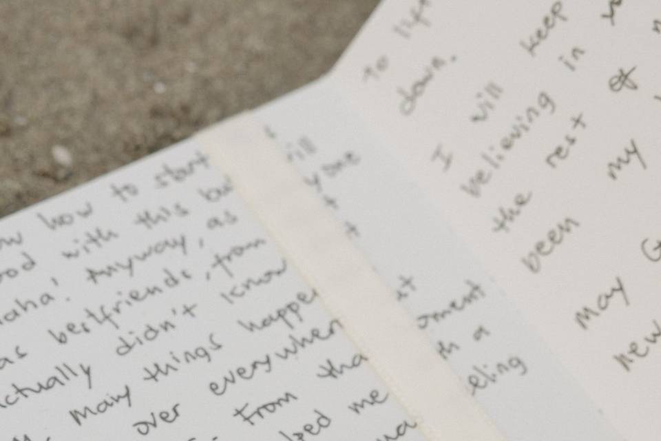 Rings on handwritten vows
