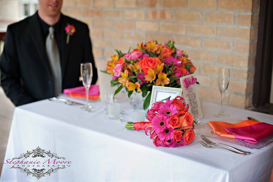 hot pink and orange table setting with groom.jpg
