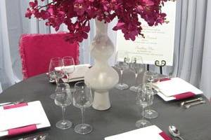 hot pink and orange table setting with groom.jpg