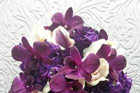 DARK PURPLE DENDROBIUM CARNATIONS PICASSO CALLA WHITE CYMBID CASCADE BOUQUET 500.jpg