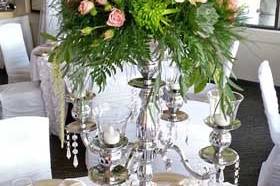 HOT PINK GREEN AND CORAL CENTERPIECE IN CHAIR FLAIR CANDELABRAS CLOSE 500.jpg