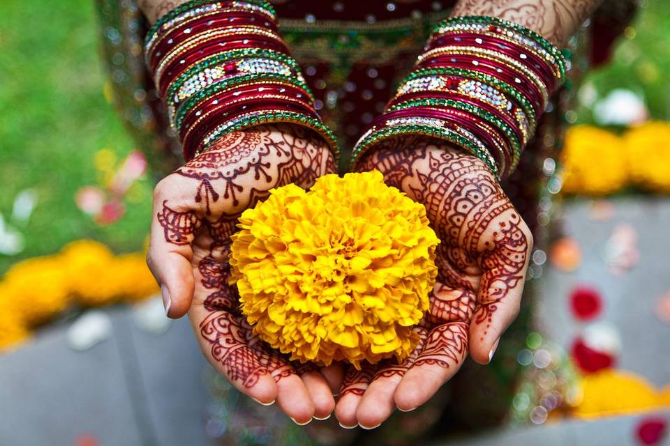 Bride w henna holding flower