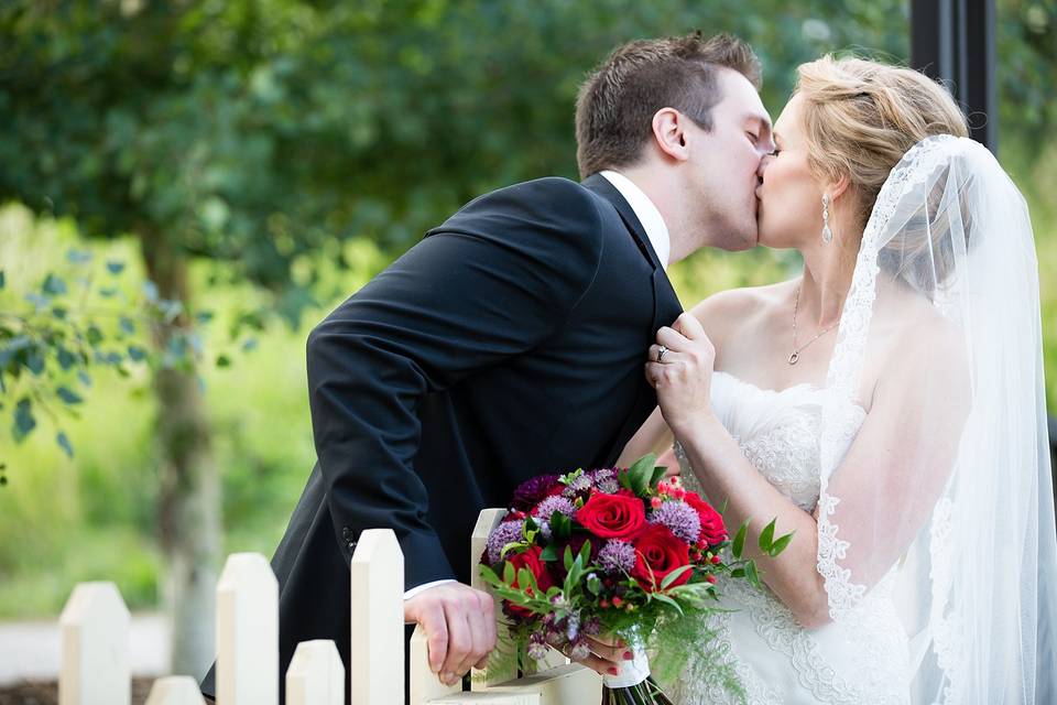 Kissing bride and groom