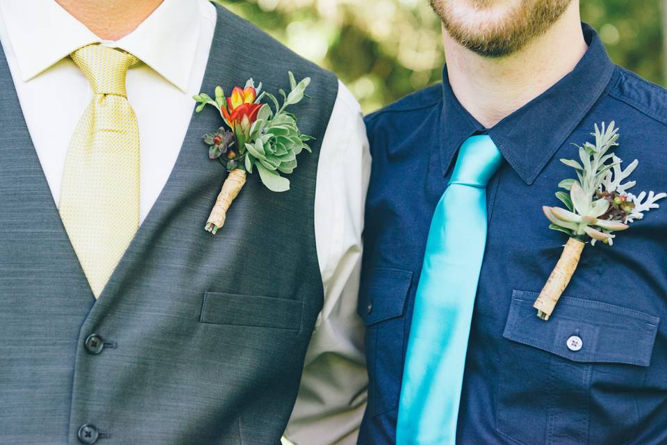 Men wearing ties and flowers