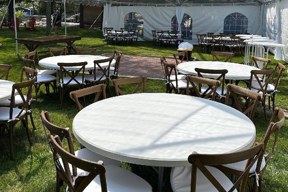 Clear tent with tables and cha