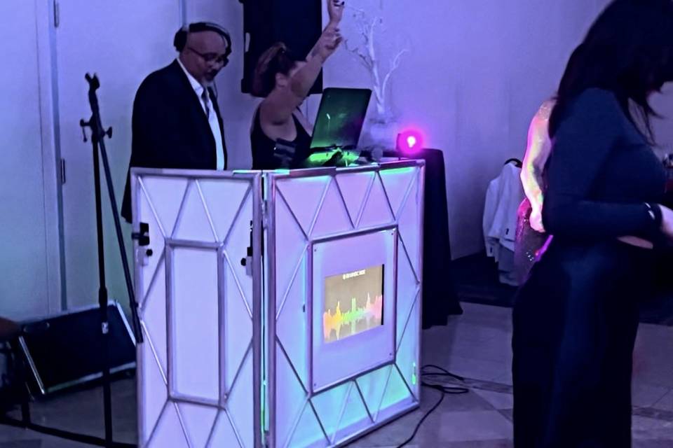 Guests dancing at the booth