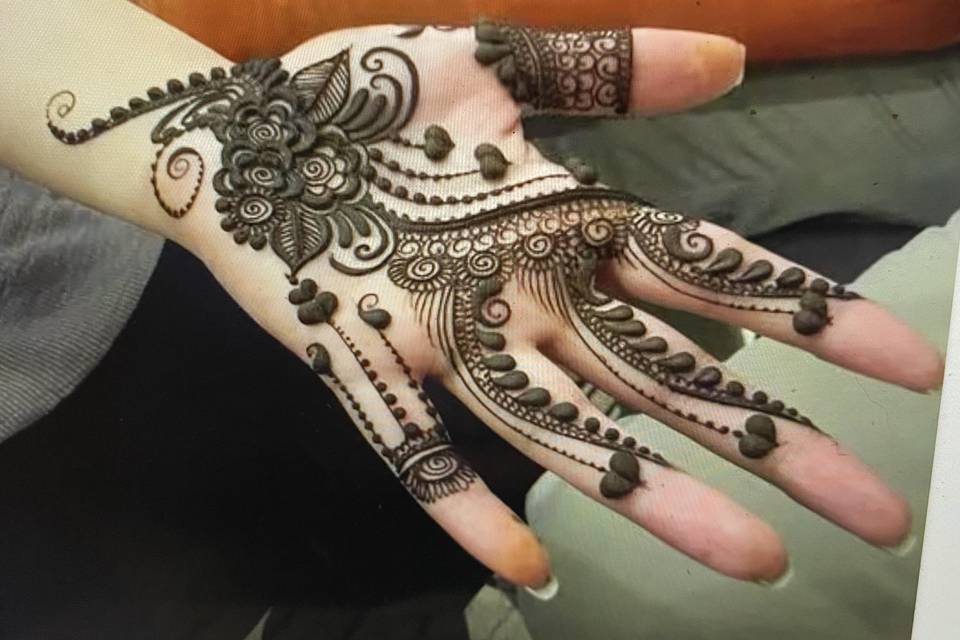 Henna design on the palm of the hand