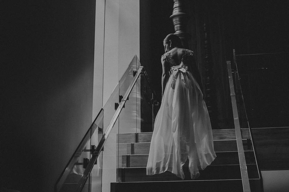 Bride walking up stairs