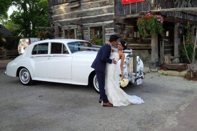 Couple by the rolls royce