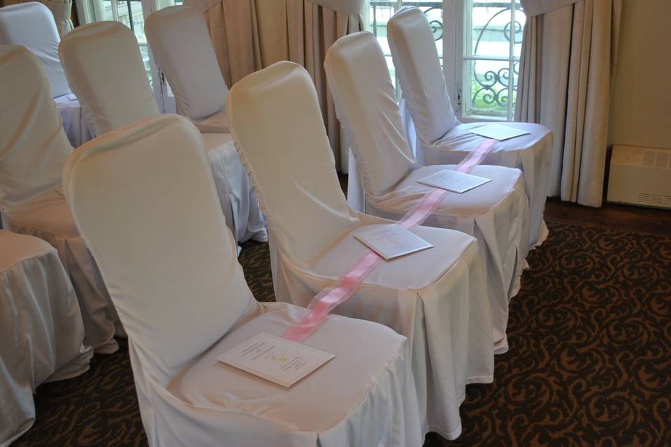 May 6 2012 Front Row Chairs with Ribbon & Programs 1.JPG