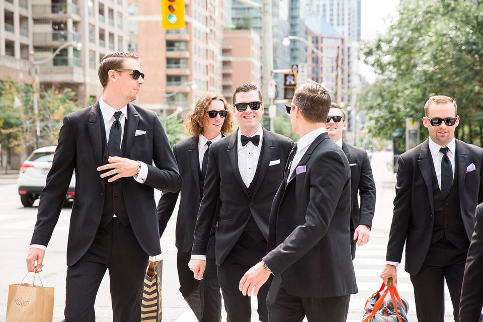 Groom and guys walking