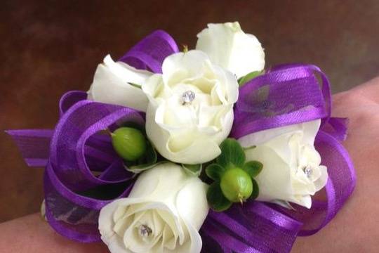 White and purple wrist corsage