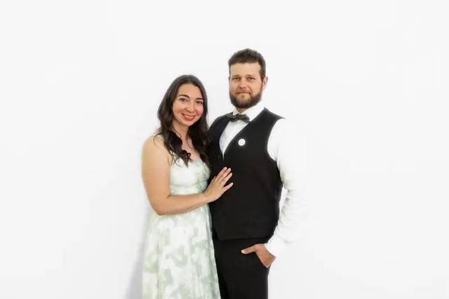 Wedding guests in front of our clean white backdrop