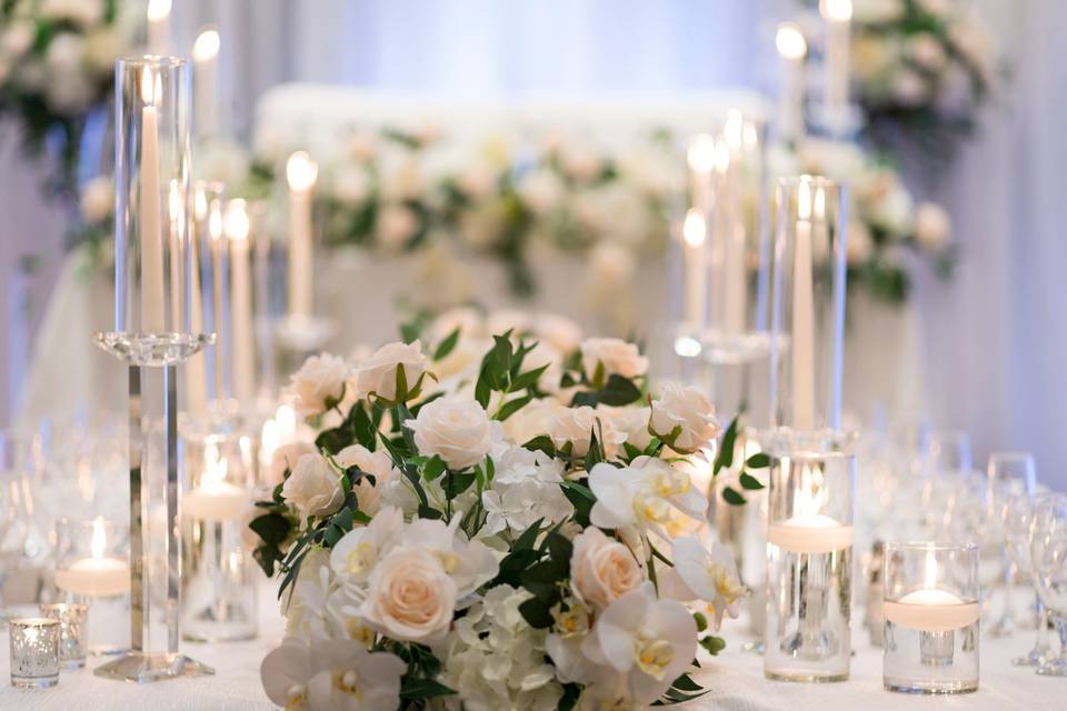 Candle and neutral flowers