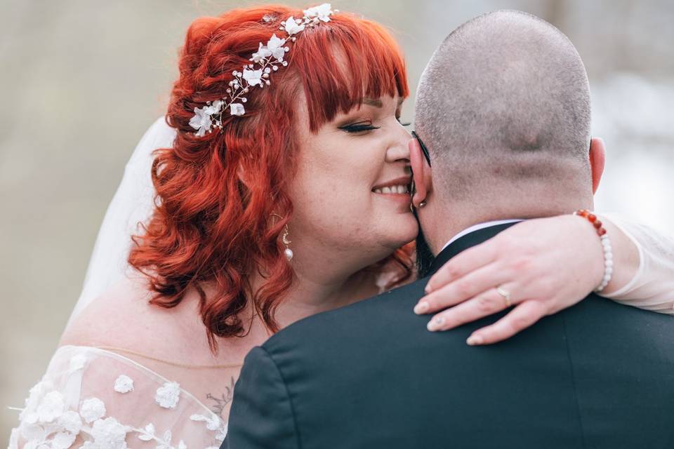 Bride whispers in groom's ear