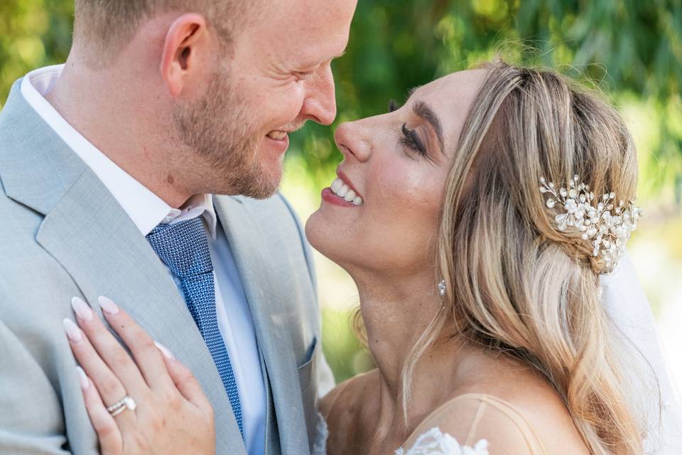 Bride hand on groom's chest