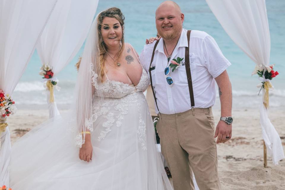 Couple smiling beach wedding